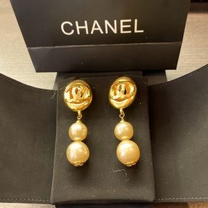 Chanel oversized authentic CC logo and faux pearl clip-on earrings.